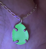 a variety of sea glass prong necklaces