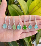 a variety of sea glass prong necklaces